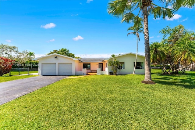 8885 SW 182nd Ter, Palmetto Bay, FL 33157 - ranch-style home featuring stucco siding, an attached garage, and driveway