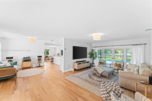 8885 SW 182nd Ter, Palmetto Bay, FL 33157 - living room featuring french doors and wood finished floors