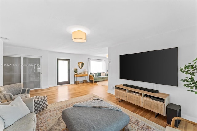 8885 SW 182nd Ter, Palmetto Bay, FL 33157 - living room featuring wood finished floors and baseboards