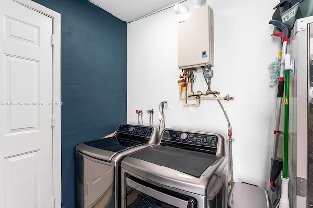 8885 SW 182nd Ter, Palmetto Bay, FL 33157 - laundry area featuring tankless water heater and washer and clothes dryer