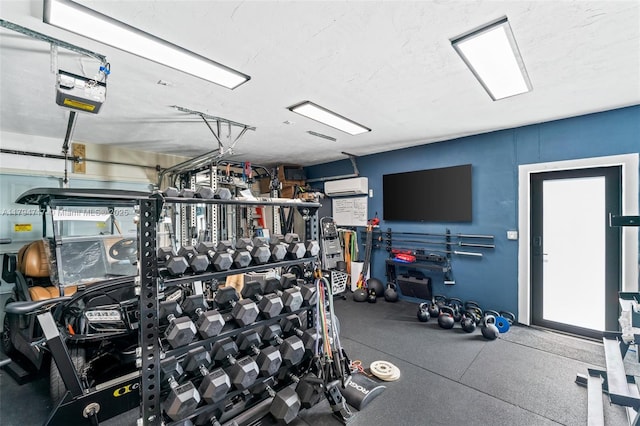 8885 SW 182nd Ter, Palmetto Bay, FL 33157 - gym with an AC wall unit and a garage