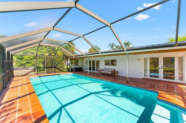 8885 SW 182nd Ter, Palmetto Bay, FL 33157 - swimming pool with french doors, a patio, and a lanai