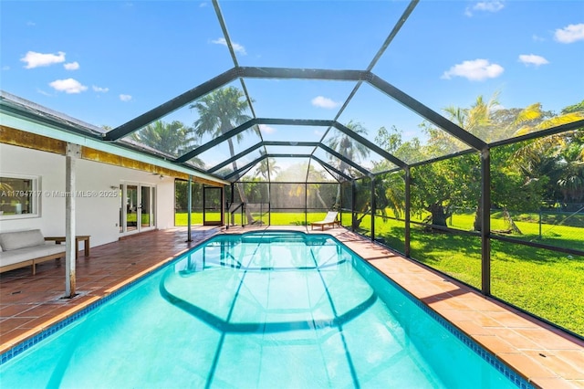 8885 SW 182nd Ter, Palmetto Bay, FL 33157 - swimming pool featuring a yard, french doors, a patio, and glass enclosure