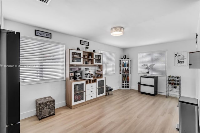 7311 Biltmore Blvd, Miramar, FL 33023 - bar featuring light wood-type flooring and baseboards