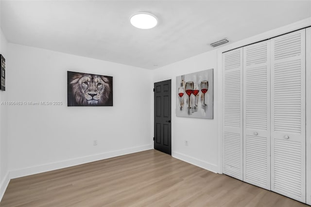7311 Biltmore Blvd, Miramar, FL 33023 - unfurnished bedroom with light wood-style floors, baseboards, and a closet