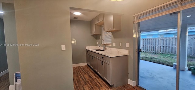 331 N 70th Way, Hollywood, FL 33024 - kitchen featuring baseboards, a sink, light countertops, dark wood-style flooring, and gray cabinetry