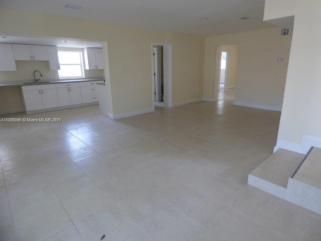 2507 N 66th Ave, Hollywood, FL 33024 - unfurnished living room featuring a sink, baseboards, and light tile patterned flooring