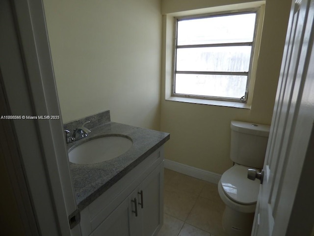 2507 N 66th Ave, Hollywood, FL 33024 - half bathroom featuring toilet, vanity, tile patterned floors, and baseboards