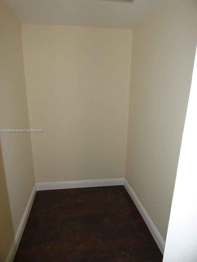 2507 N 66th Ave, Hollywood, FL 33024 - spare room with baseboards and dark wood-style flooring