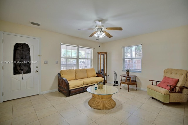 210 Joe Hilton St, Avon Park, FL 33825 - living room with a ceiling fan, light tile patterned floors, and baseboards