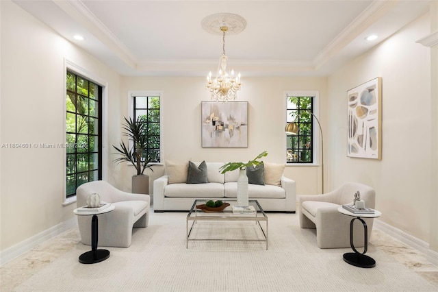living room with marble finish floors, a chandelier, recessed lighting, a tray ceiling, and crown molding