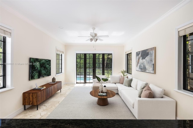 living area featuring crown molding, a ceiling fan, light marble finish floors, french doors, and baseboards