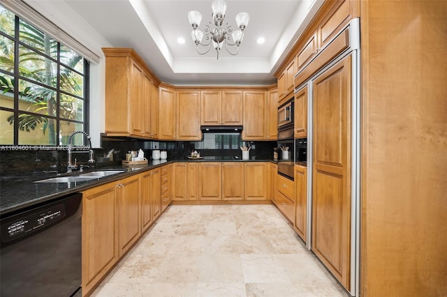 kitchen featuring black appliances, a sink, a chandelier, tasteful backsplash, and a raised ceiling
