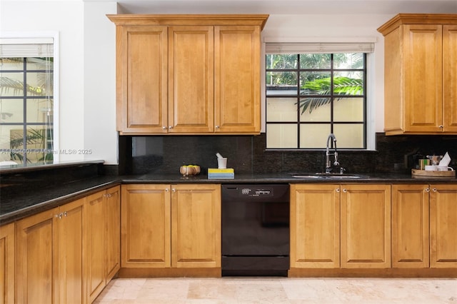 kitchen with black dishwasher, a sink, tasteful backsplash, and brown cabinets