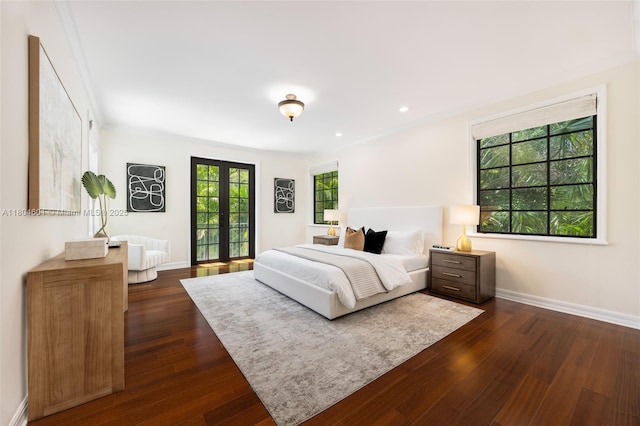 bedroom featuring french doors, dark wood finished floors, baseboards, and recessed lighting