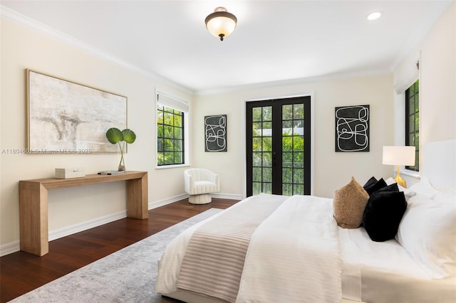 bedroom with wood finished floors, crown molding, baseboards, french doors, and recessed lighting