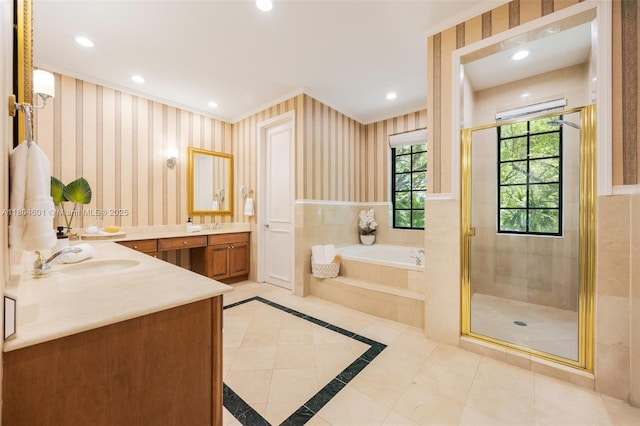 bathroom with a stall shower, a bath, double vanity, inlaid floor details, and crown molding