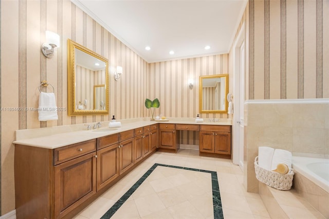 bathroom featuring double vanity, tiled bath, wallpapered walls, recessed lighting, and ornamental molding