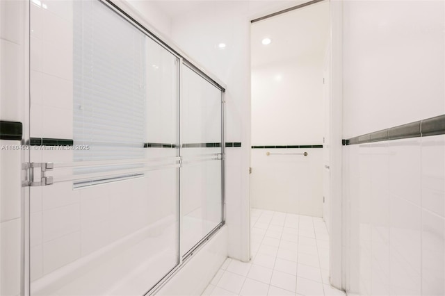 bathroom featuring a shower with door and tile patterned floors