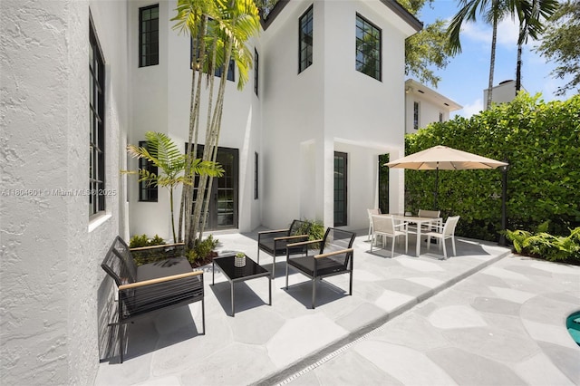 view of patio / terrace with outdoor dining area and an outdoor living space