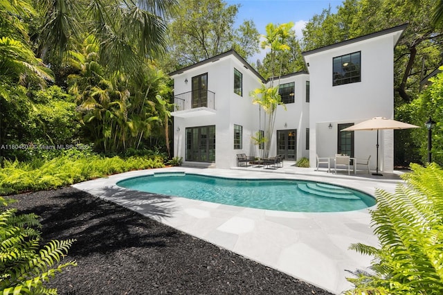 swimming pool featuring a patio area