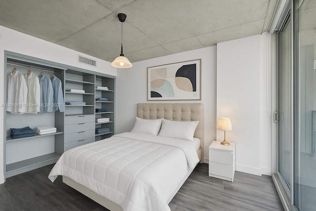 690 SW 1st Ct Unit 2717, Miami, FL 33130 - bedroom with dark wood-type flooring and baseboards