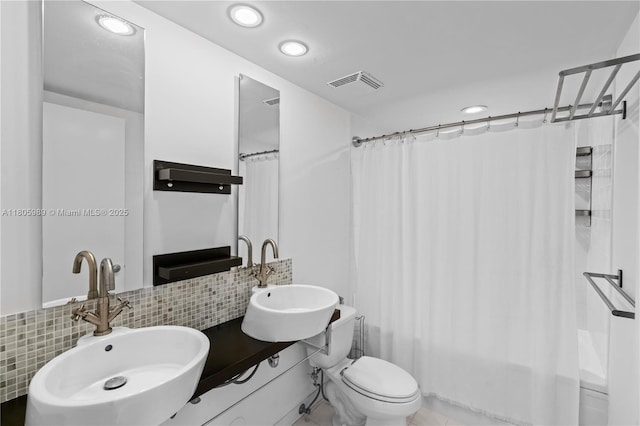 690 SW 1st Ct Unit 2717, Miami, FL 33130 - bathroom with a sink, backsplash, shower / bath combination with curtain, recessed lighting, and toilet