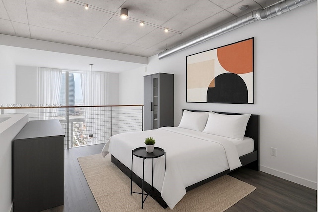 690 SW 1st Ct Unit 2717, Miami, FL 33130 - bedroom with dark wood-style floors and rail lighting