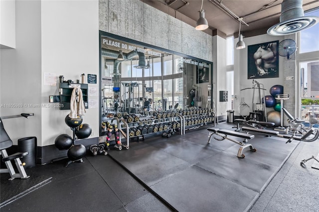 690 SW 1st Ct Unit 2717, Miami, FL 33130 - workout area featuring a towering ceiling and healthy amount of natural light