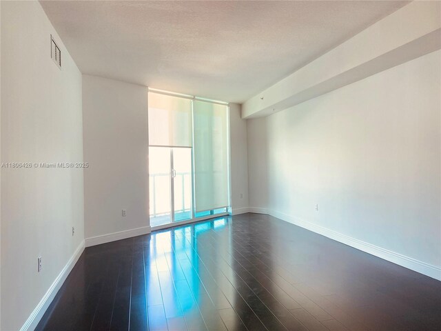 1900 N Bayshore Dr Unit 4708, Miami, FL 33132 - unfurnished room with dark wood-style flooring and baseboards