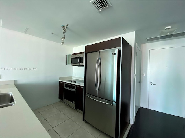 1900 N Bayshore Dr Unit 4708, Miami, FL 33132 - kitchen featuring appliances with stainless steel finishes, light countertops, and light tile patterned flooring