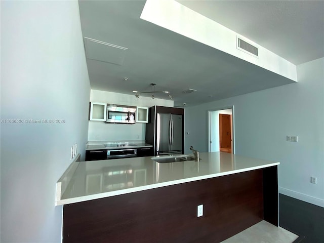 1900 N Bayshore Dr Unit 4708, Miami, FL 33132 - kitchen featuring appliances with stainless steel finishes, light countertops, and a peninsula
