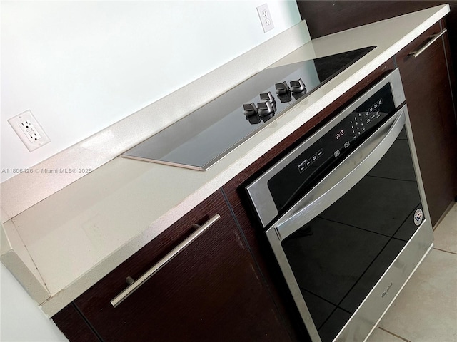 1900 N Bayshore Dr Unit 4708, Miami, FL 33132 - kitchen view of oven, light countertops, and dark brown cabinetry