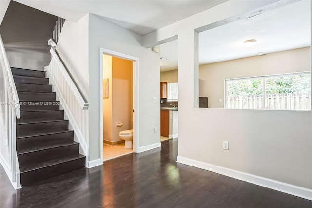 355 SE 20th Ter, Homestead, FL 33033 - spare room with stairs, wood finished floors, and baseboards