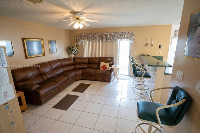 19121 NW 12th St, Pembroke Pines, FL 33029 - living area featuring light tile patterned flooring, a ceiling fan, and a textured ceiling