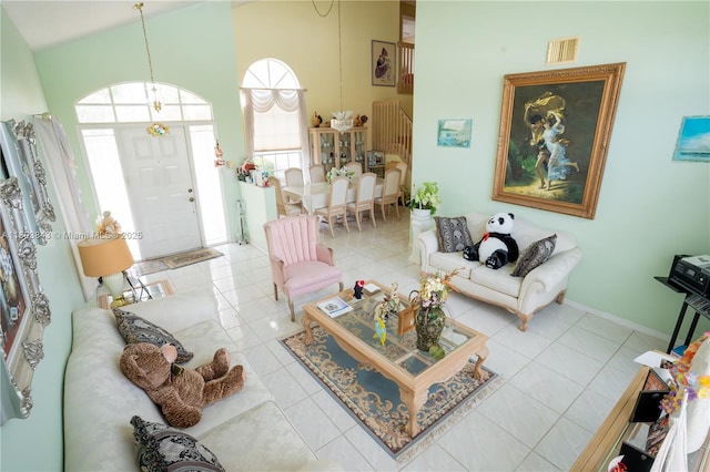 19121 NW 12th St, Pembroke Pines, FL 33029 - living room with tile patterned flooring, a high ceiling, and baseboards