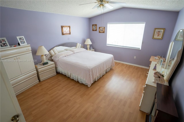 19121 NW 12th St, Pembroke Pines, FL 33029 - bedroom featuring light wood-style floors, vaulted ceiling, ceiling fan, a textured ceiling, and baseboards