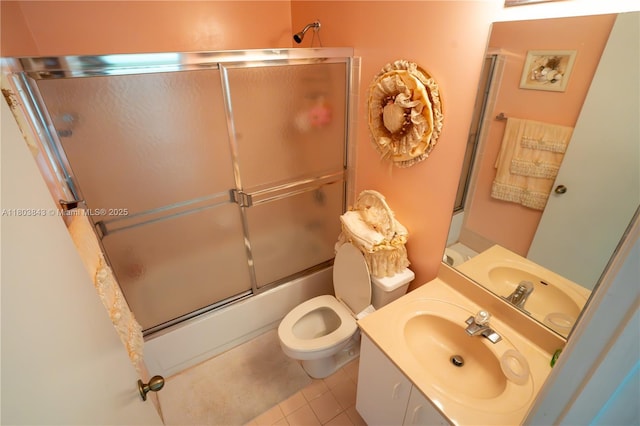19121 NW 12th St, Pembroke Pines, FL 33029 - bathroom with combined bath / shower with glass door, tile patterned floors, vanity, and toilet