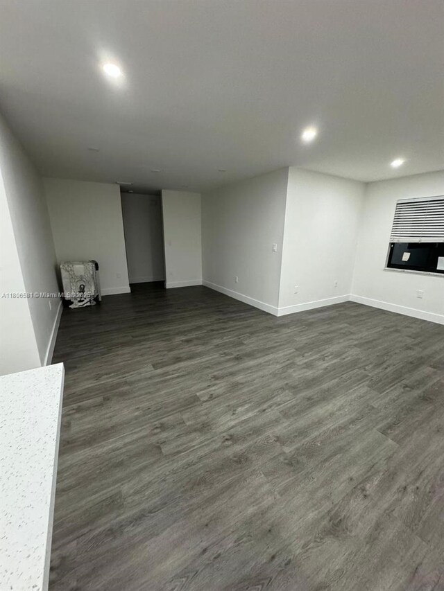 940 SW 78th Pl, Miami, FL 33144 - unfurnished living room featuring recessed lighting, baseboards, and dark wood finished floors
