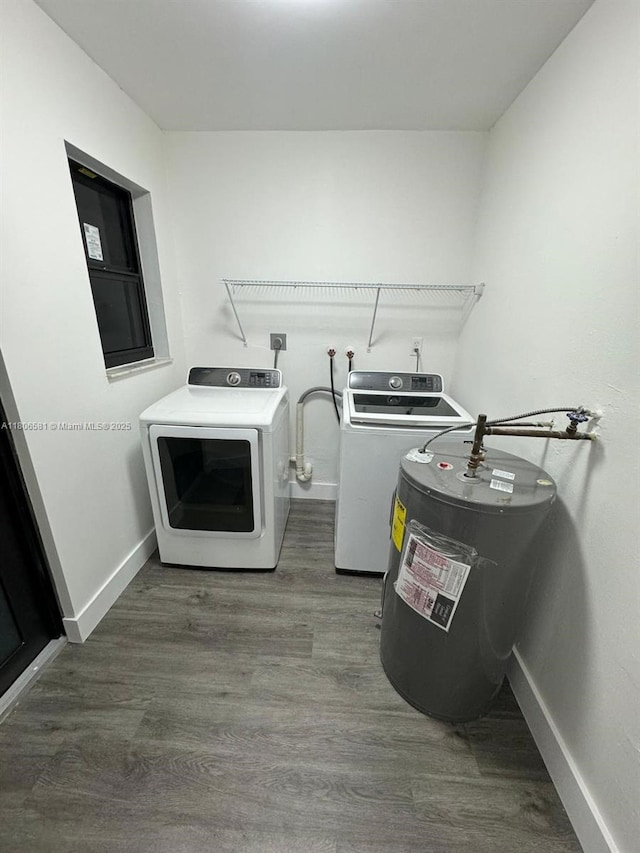 940 SW 78th Pl, Miami, FL 33144 - washroom with separate washer and dryer, wood finished floors, baseboards, and water heater