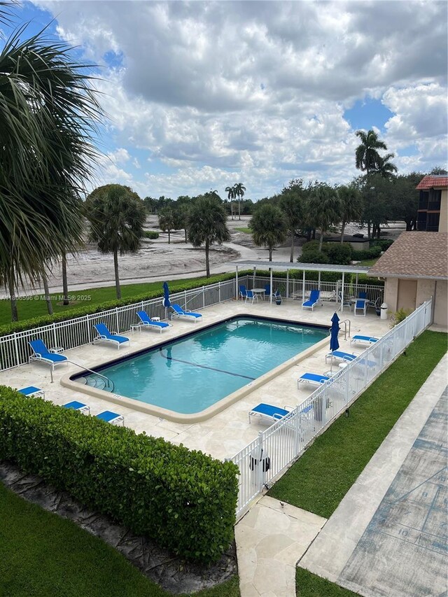 250 Jacaranda Dr Unit 303, Plantation, FL 33324 - community pool featuring a patio