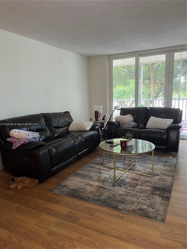 250 Jacaranda Dr Unit 303, Plantation, FL 33324 - living area with wood finished floors and a textured ceiling