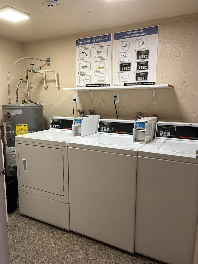 250 Jacaranda Dr Unit 303, Plantation, FL 33324 - community laundry with washer and clothes dryer, electric water heater, and a textured wall