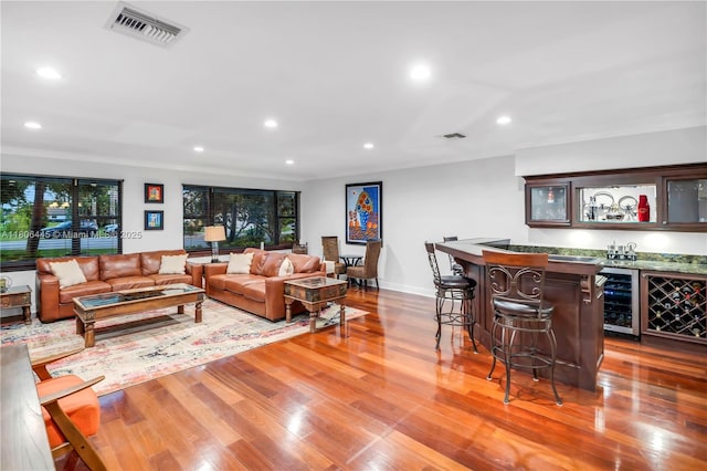 11915 Green Oak Dr, Davie, FL 33330 - living room featuring wine cooler, a bar, recessed lighting, wood finished floors, and baseboards