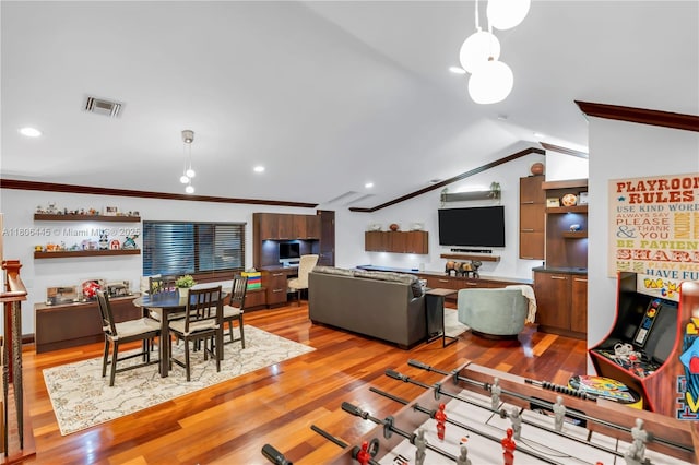 11915 Green Oak Dr, Davie, FL 33330 - living area featuring vaulted ceiling, crown molding, wood finished floors, and recessed lighting