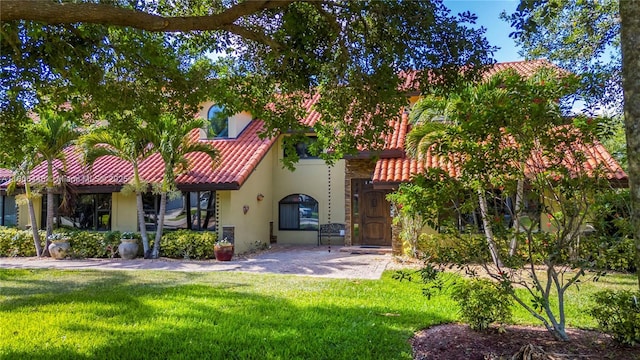 11915 Green Oak Dr, Davie, FL 33330 - back of house with stucco siding, a tile roof, and a lawn