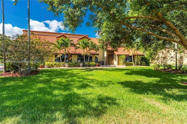 11915 Green Oak Dr, Davie, FL 33330 - rear view of house with a tiled roof, a lawn, and stucco siding