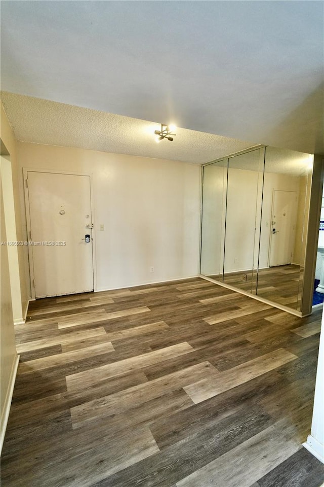 2821NE163RDST N Miami Beach Blvd Unit 4X, North Miami Beach, FL 33160 - spare room featuring wood finished floors and baseboards
