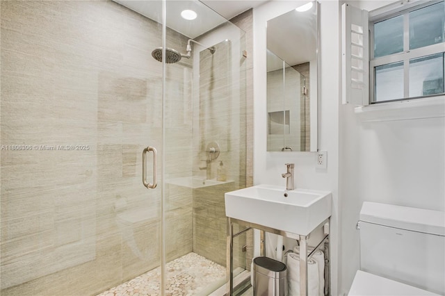 45 Antilla Ave Unit 1G, Coral Gables, FL 33134 - bathroom featuring toilet, a shower stall, and a sink