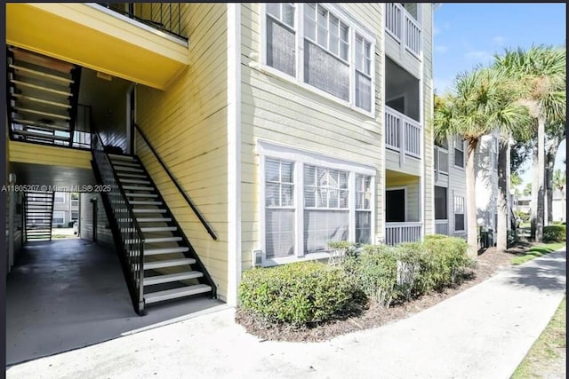 1055 S Hiawassee Rd Unit 2014, Orlando, FL 32835 - view of property exterior with stairs
